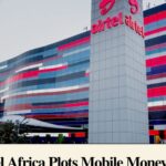 Intricate fractal art featuring swirling teal and gold patterns against a dark navy background