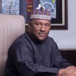 Smooth flowing gradient blending deep teal into vibrant violet with subtle light streaks