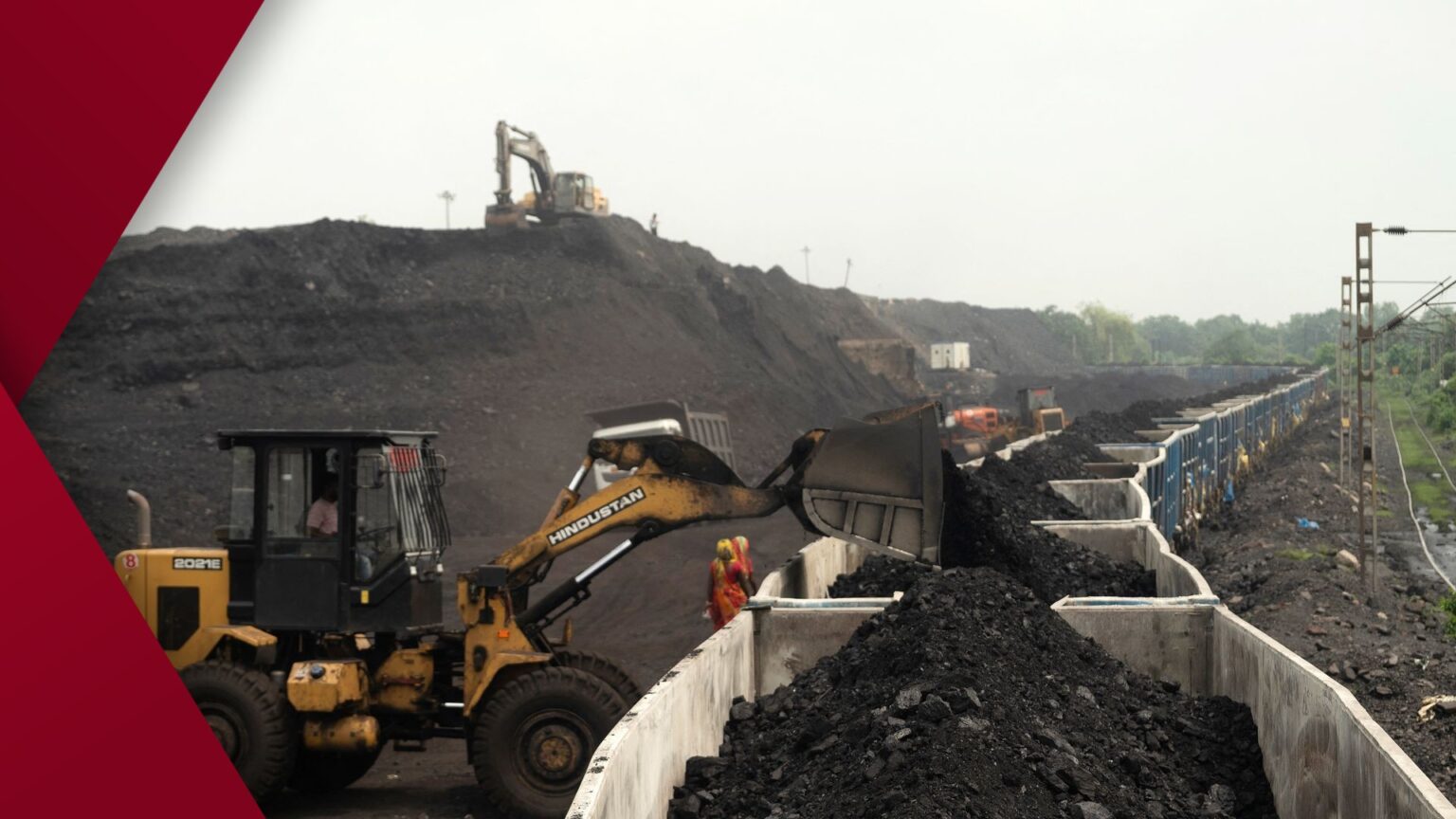 Close-up of a metallic emerald-green dragonfly resting on a dry brown twig against a softly blurred background