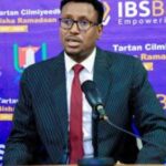 Close-up of vibrant red strawberries arranged on a clean white plate, highlighting freshness and natural texture