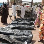 Laptop displaying a content management system dashboard with analytics charts and navigation menu