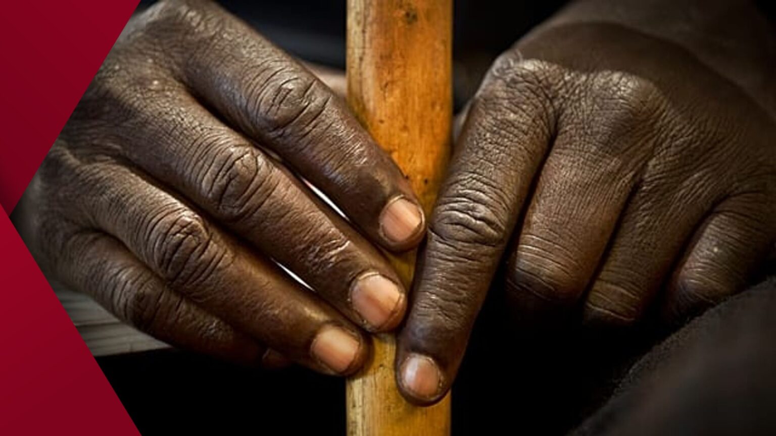 Modern high-rise office building featuring a fully reflective glass exterior that mirrors the surrounding cityscape and sky