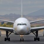 Seamless teal and black geometric texture resembling encrypted data