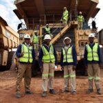 Close-up of an abstract green digital texture with layered hexagonal patterns and subtle light streaks