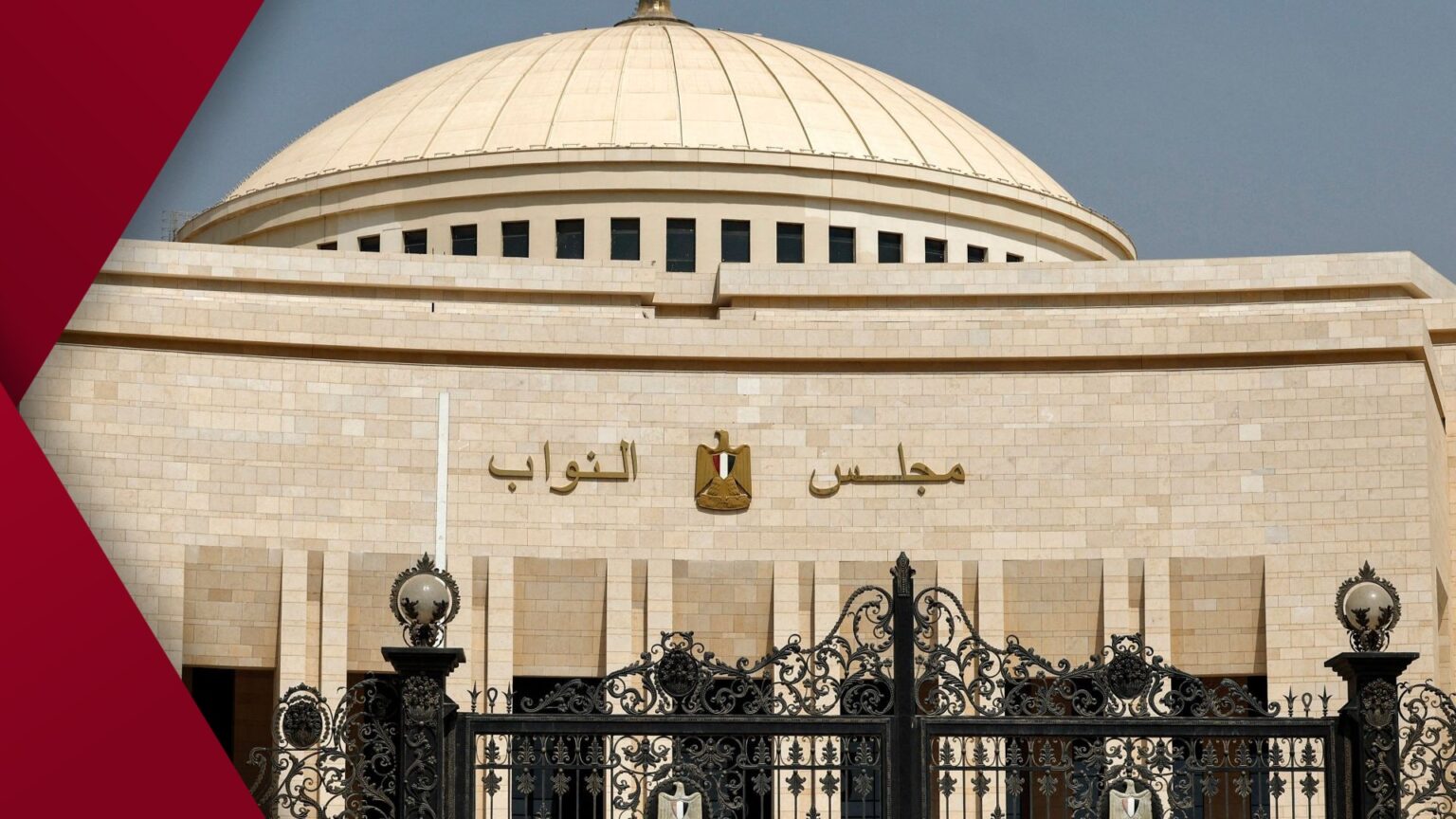 Construction site near the Nile with workers, heavy machinery and concrete pillars