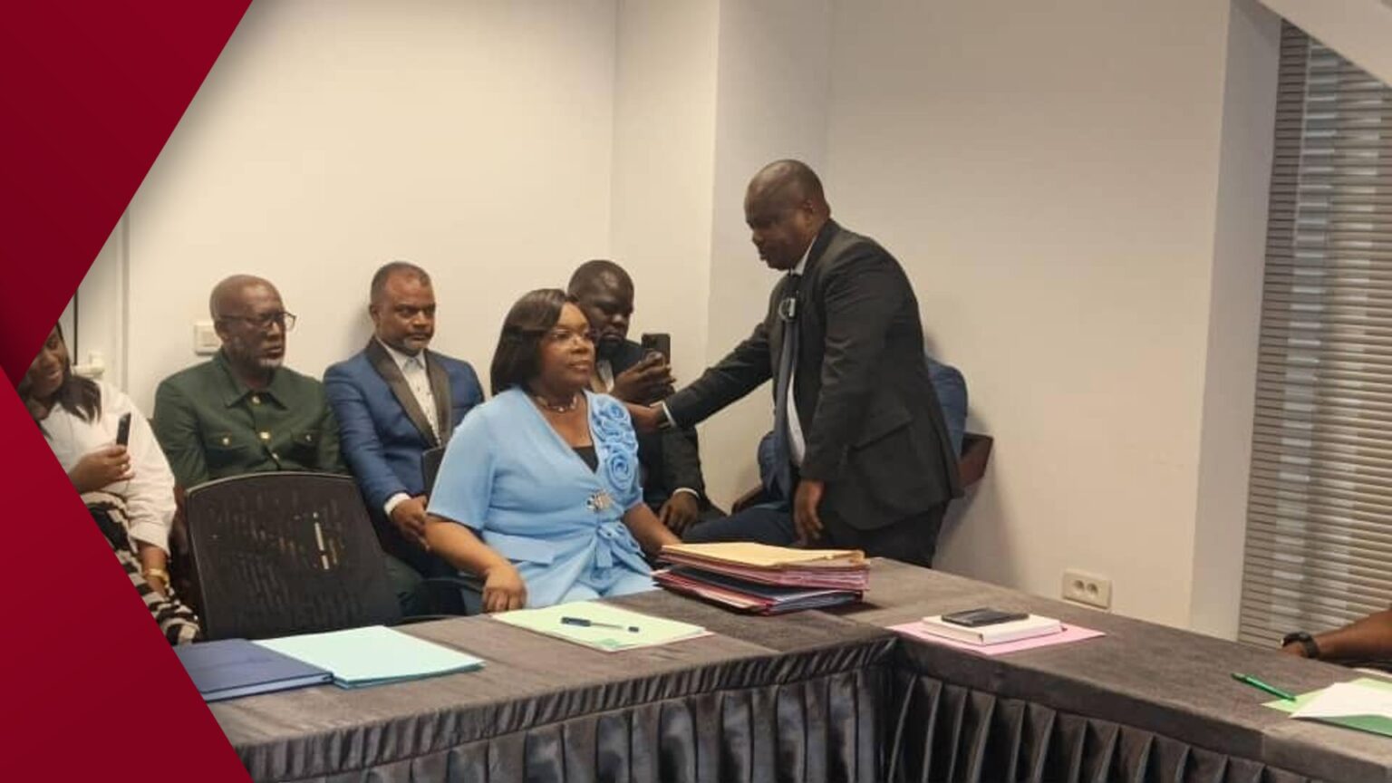 Smiling friends huddle together for a casual indoor selfie on 6 February 2026