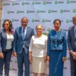 Busy Jakarta street captured on 6 Feb 2026 via WhatsApp, showing colorful market stalls and local commuters