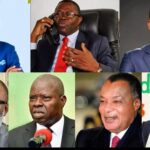 Group of diverse friends laughing and clinking cocktail glasses on a city rooftop during vibrant sunset