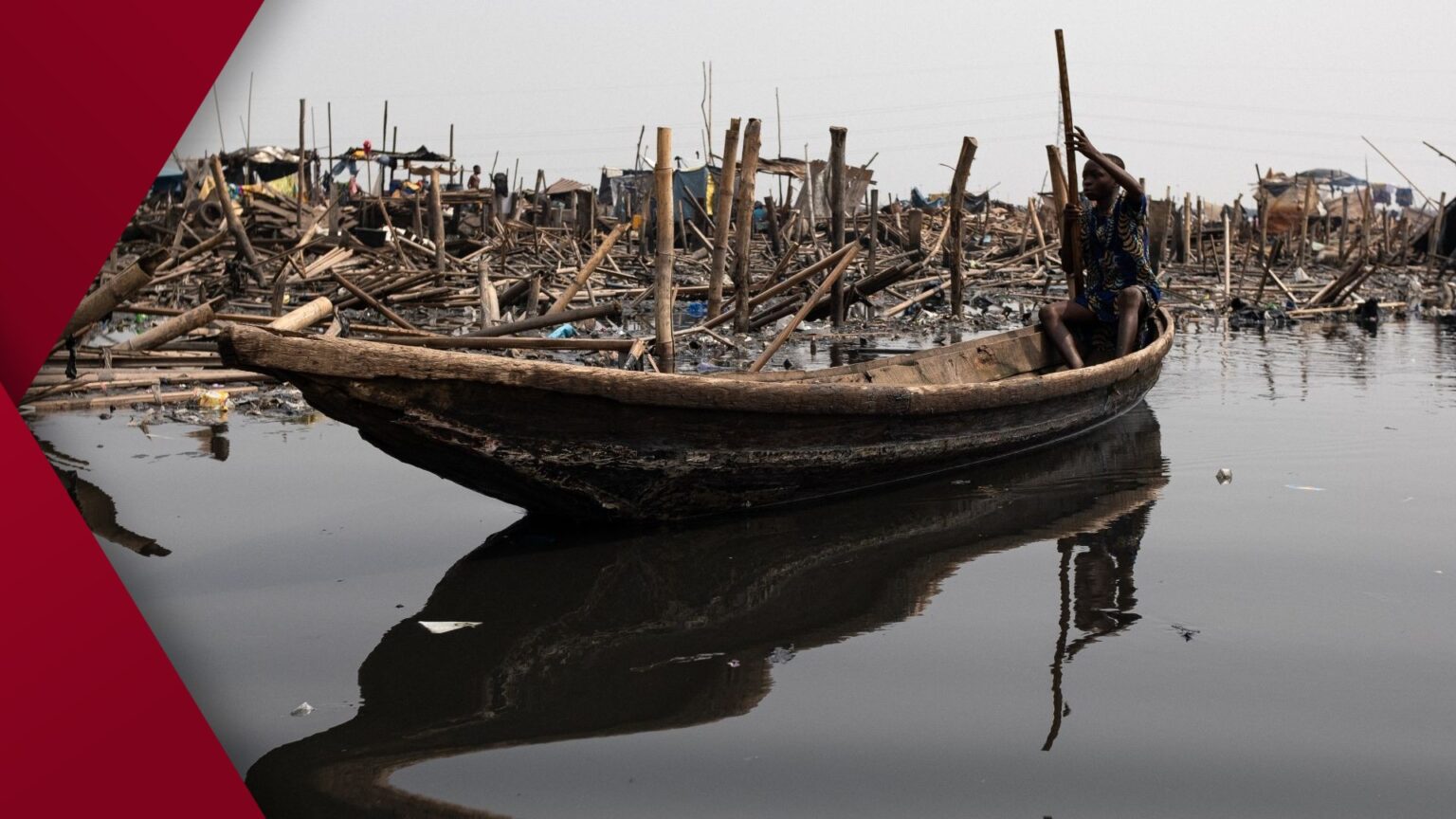 Perfectly calm mountain lake at dawn, reflecting snow-capped peaks and golden sunrise sky