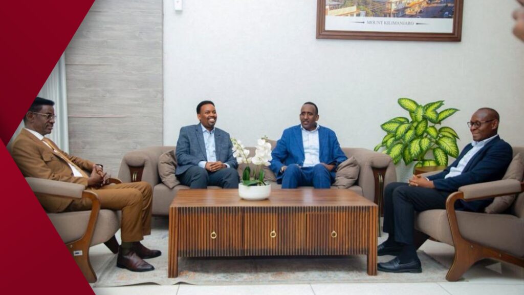 Single weathered plank bench with wrought-iron legs sitting on a gravel path, surrounded by blooming lavender and soft sun-flare