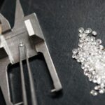 Seamless abstract geometric pattern in teal and purple with overlapping triangles and hexagons