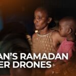 Clean white desk with laptop, wireless mouse, succulent plant and natural lighting